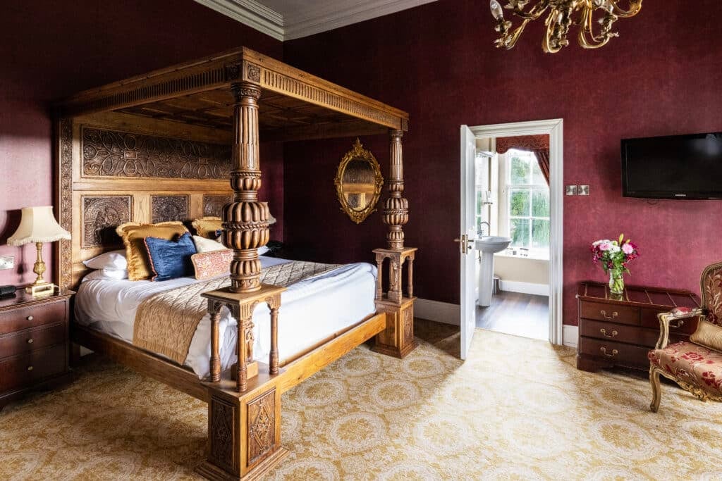Authentic, unique four-poster bed in a superior Belleek Castle room for a real castle experience.